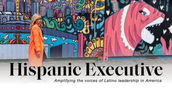 Text: Hispanic Executive, Amplifying the voices of Latino leadership in America. Image: Jeanette Hernandez Prenger walks in front of a colorful mural.
